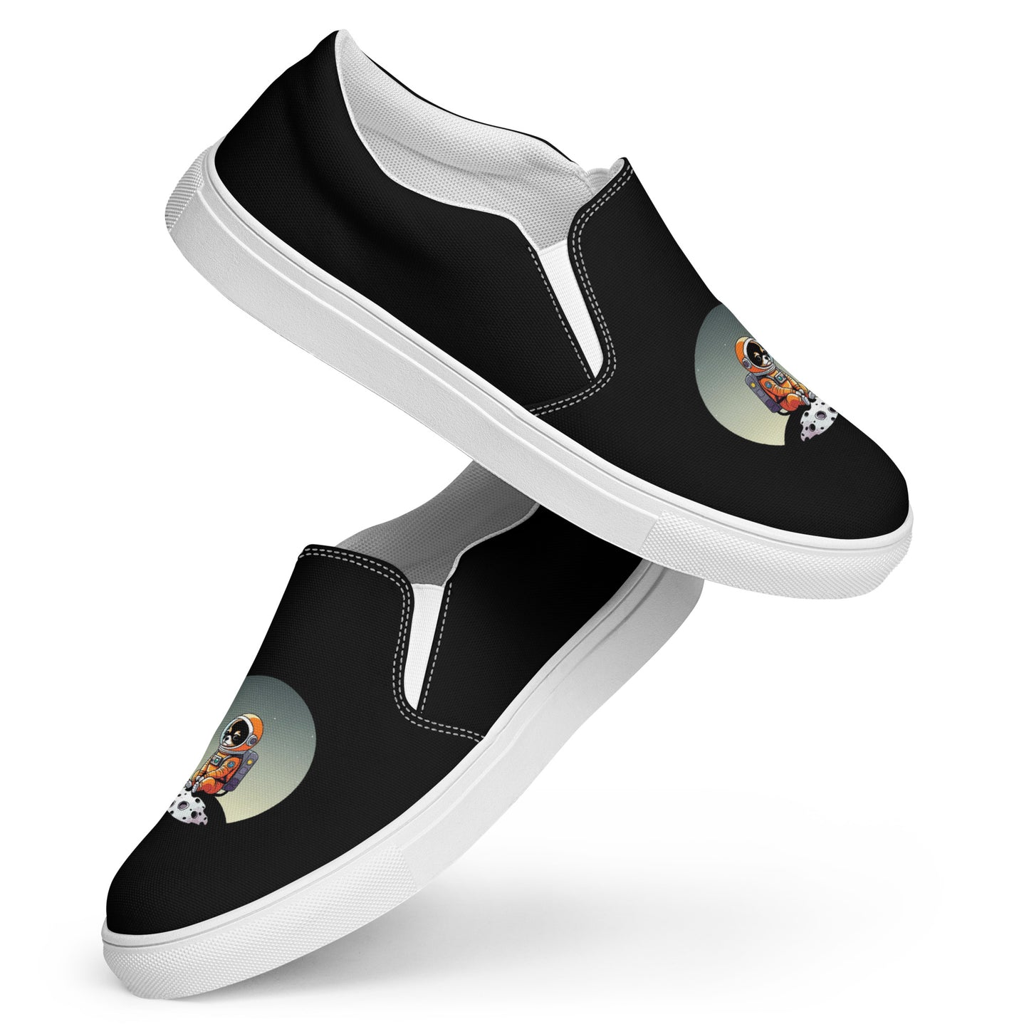 Product image of a black pair of women's slip on canvas shoes featuring a cute astronaut Chihuahua dog sitting on a small moon.