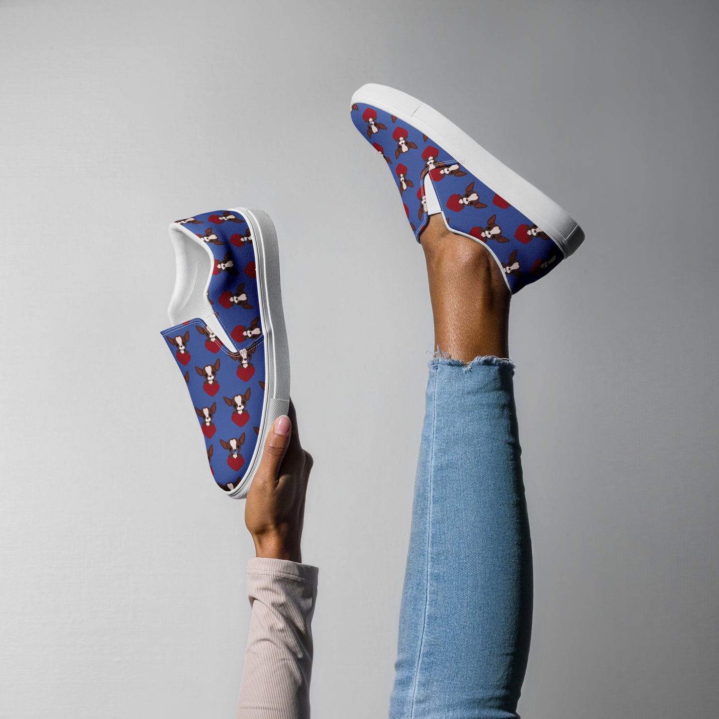 Photo of a woman leg wearing a of Blue women's canvas shoe with a Chihuahua themed pattern.
