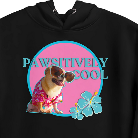 Closeup image of a black color hoodie with a front cute print of a chihuahua dog wearing sun glasses, with the fun quote "Pawsitively Cool" behind it.