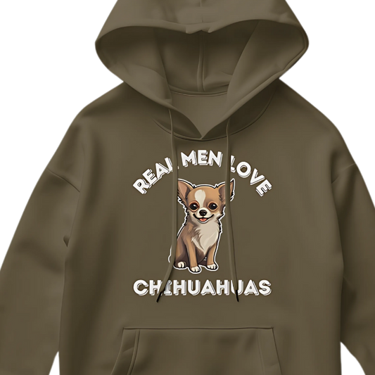 Color photo close up of a Green Color Hoodie with artwork depicting a cute Chihuahua dog illustration  surrounded by white letters that say "REAL MEN LOVE CHIHUAHUAS".